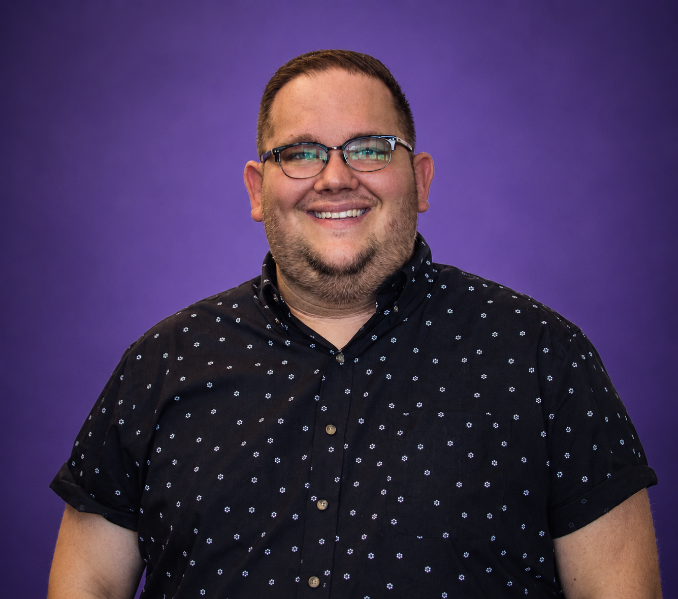Portrait of host Jeff Allen smiling against a purple background